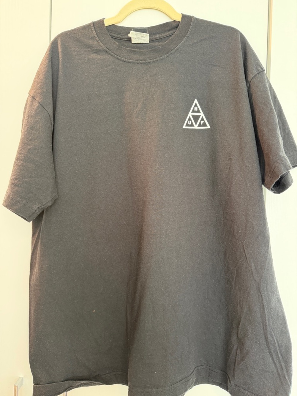 HUF Black Short Sleeve Tee with Small White Triangle Logo on Chest